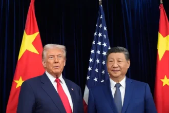 President Donald Trump, left, and Chinese President Xi Jinping, right, pose for photo before their US-China summit at Gimhae international airport in Busan, South Korea, on October 30, 2025 [Mark Schiefelbein/AP Photo]